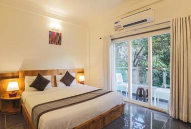 2 star hotel bedroom at Aaria Residency in Arambol